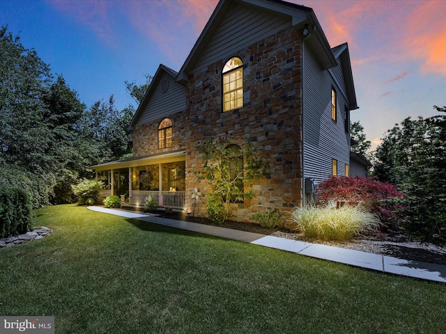 exterior space with a yard and a porch