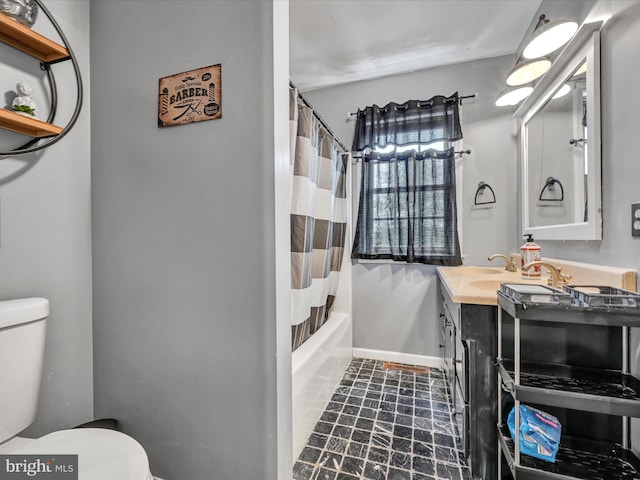 full bathroom featuring shower / tub combo, vanity, and toilet