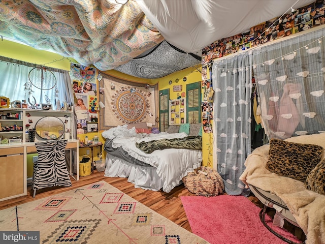 bedroom featuring hardwood / wood-style flooring