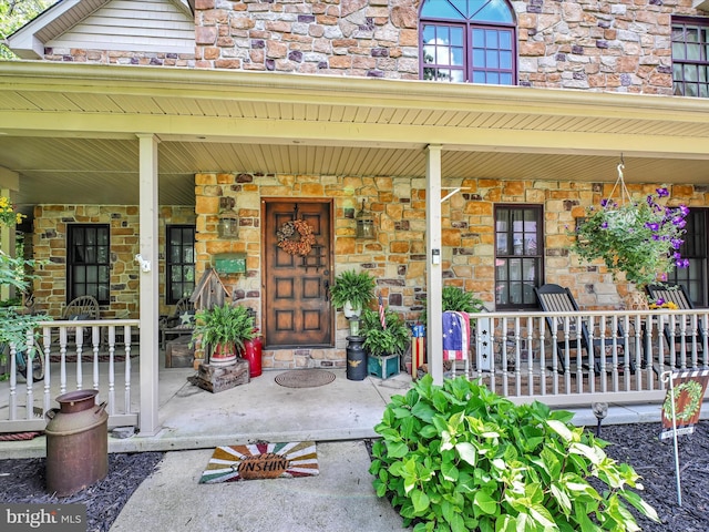 entrance to property with a porch