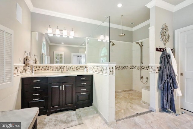 bathroom featuring a shower, vanity, and ornamental molding