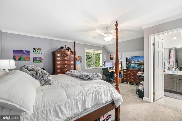 carpeted bedroom featuring ensuite bathroom, ceiling fan, crown molding, and sink