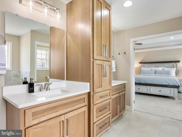 bathroom with tile patterned floors and vanity