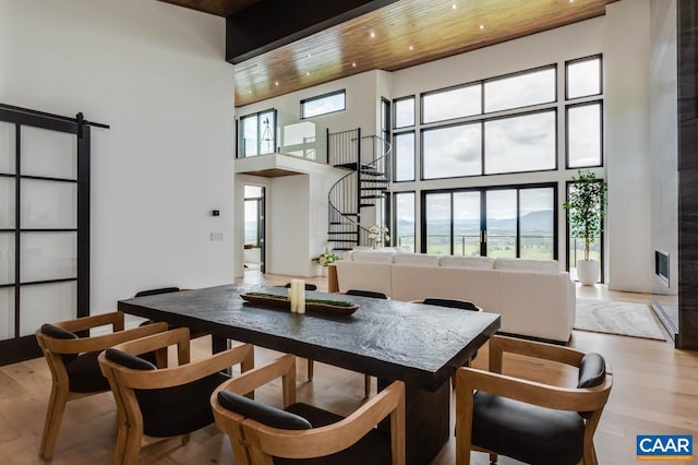 225 Cherry Ridge Ln, Lexington, VA 24450 - dining area with a barn door, hardwood / wood-style floors, a towering ceiling, and wooden ceiling