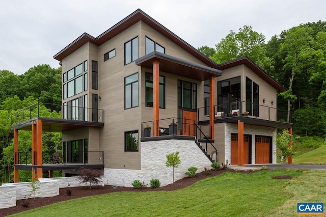 225 Cherry Ridge Ln, Lexington, VA 24450 - view of front facade with a balcony, a front yard, a garage, and stone siding