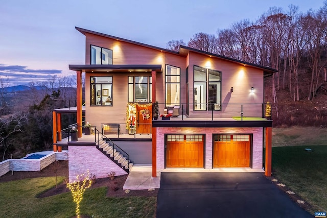 225 Cherry Ridge Ln, Lexington, VA 24450 - contemporary house featuring an attached garage, stairs, asphalt driveway, and a front yard