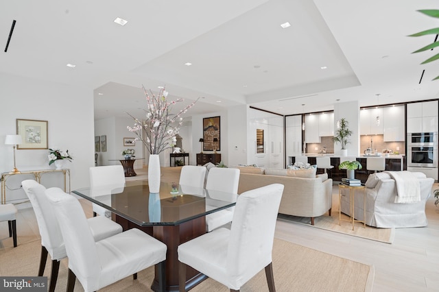 dining space featuring light wood-type flooring