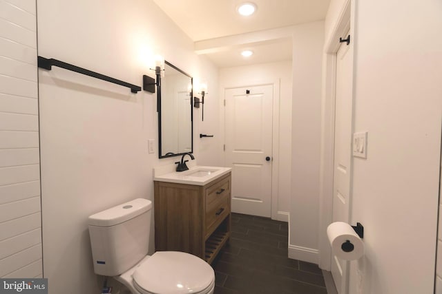 bathroom with tile patterned floors, vanity, and toilet