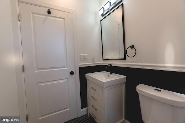 bathroom with vanity and toilet