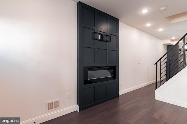 foyer with dark hardwood / wood-style floors