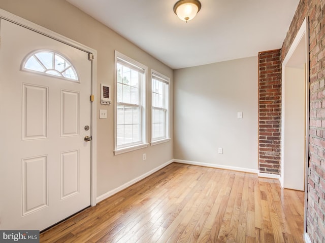 foyer entrance with light wood-type flooring