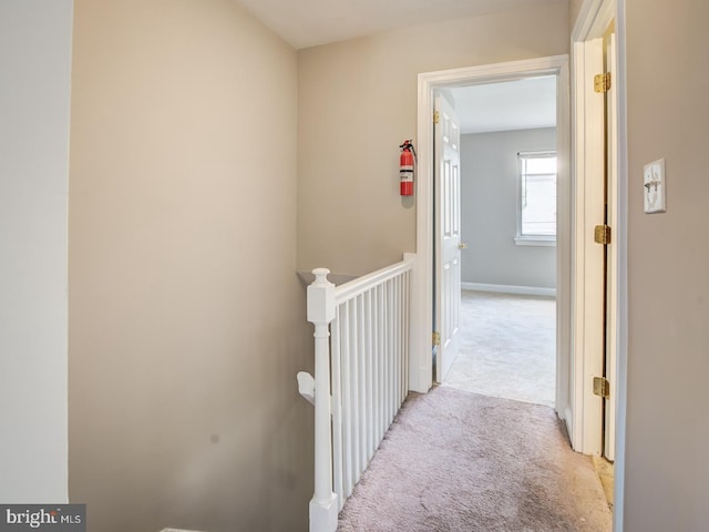 hall with light carpet