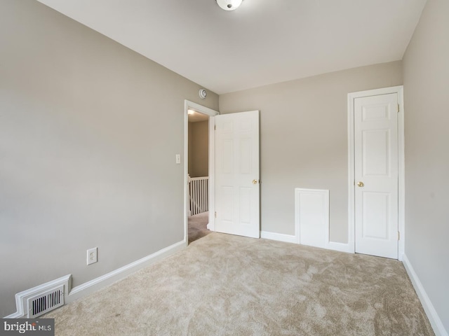 unfurnished bedroom with carpet