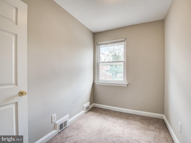 unfurnished room with carpet flooring