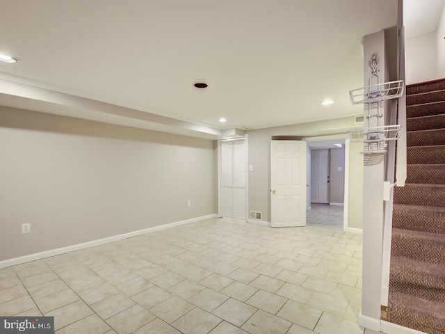 basement featuring light tile patterned floors