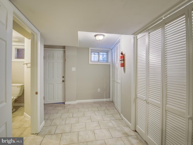 hallway with light tile patterned flooring