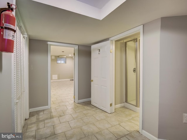 hallway with light tile patterned floors