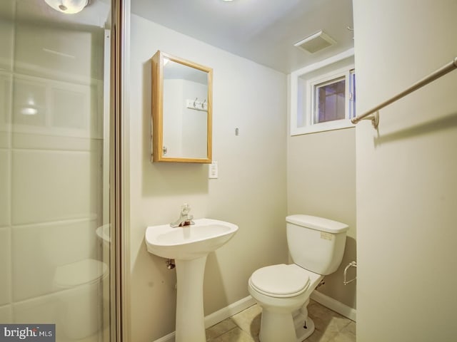 bathroom with tile patterned flooring and toilet