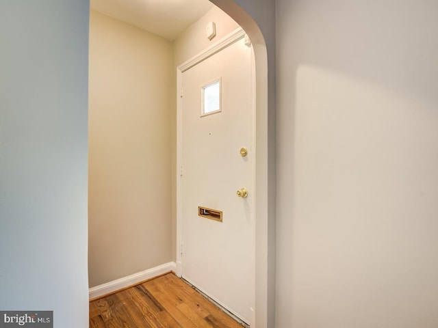 doorway with wood-type flooring