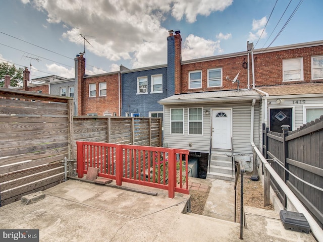 rear view of property with a patio area