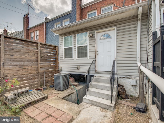 entrance to property featuring central air condition unit