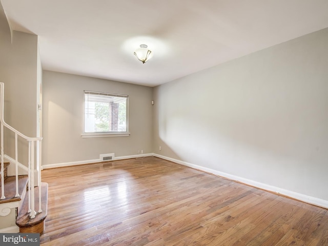 unfurnished room featuring light hardwood / wood-style floors