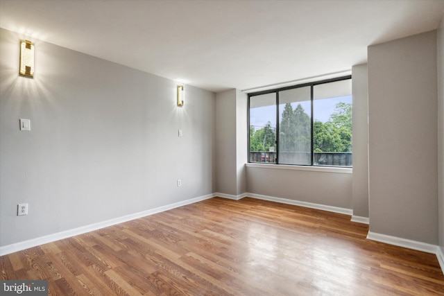 empty room featuring hardwood / wood-style flooring