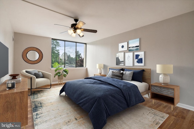 bedroom featuring ceiling fan and wood-type flooring