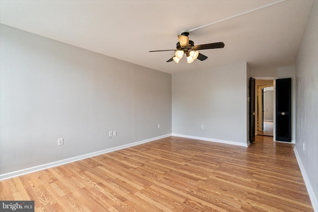 empty room featuring light hardwood / wood-style floors and ceiling fan