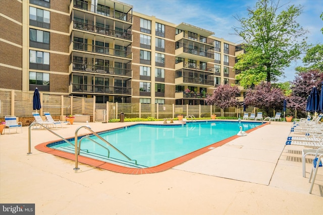 view of swimming pool with a patio