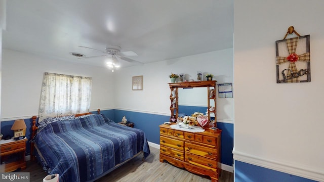 bedroom featuring hardwood / wood-style flooring and ceiling fan