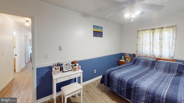 bedroom featuring ceiling fan and hardwood / wood-style flooring