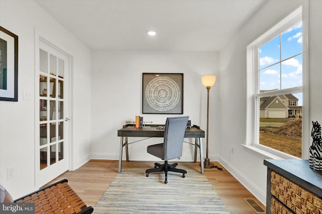 office area featuring light hardwood / wood-style flooring