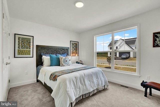 bedroom with light carpet