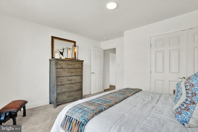 carpeted bedroom featuring a closet