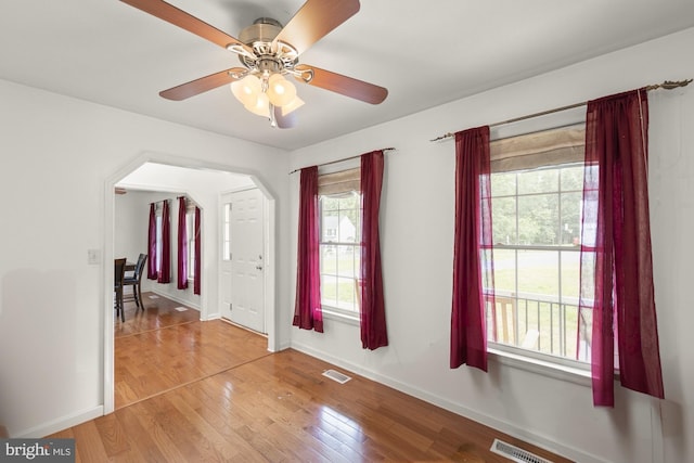 interior space featuring hardwood / wood-style flooring, ceiling fan, and a wealth of natural light