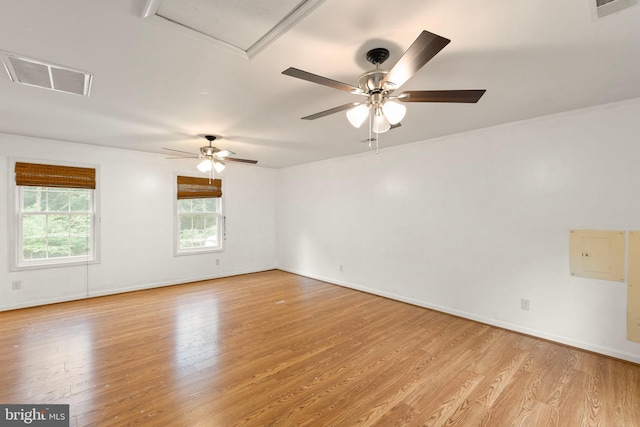 spare room with ceiling fan and light wood-type flooring