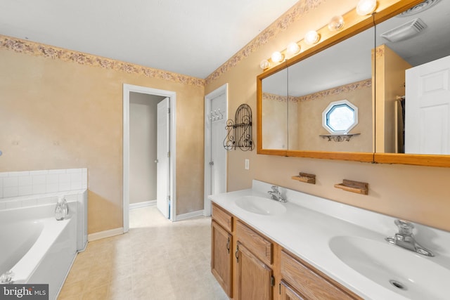 bathroom with a bath and vanity