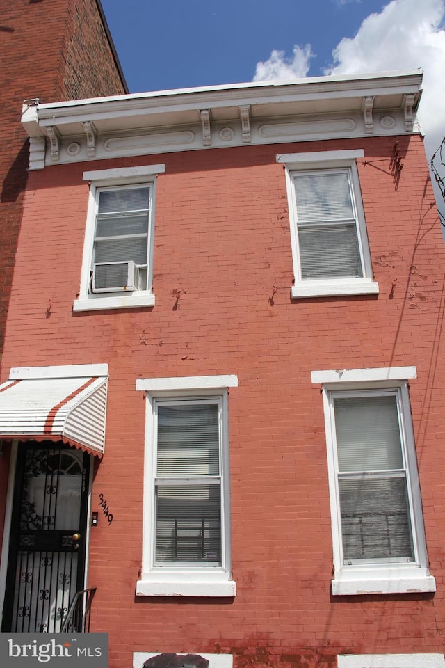 view of side of property with cooling unit