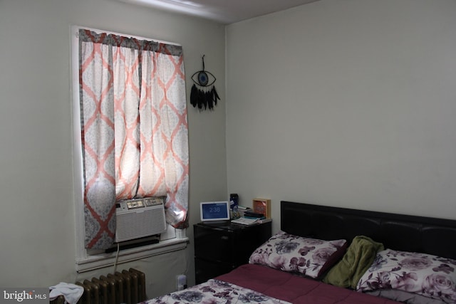 bedroom featuring radiator and cooling unit