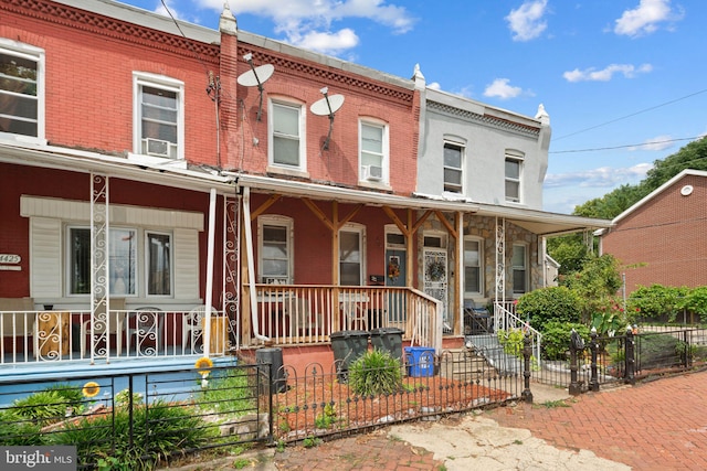 view of property featuring covered porch