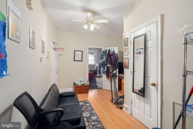 foyer featuring ceiling fan and wood-type flooring