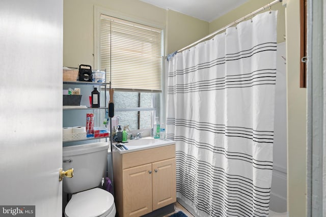 bathroom with toilet, vanity, and a shower with shower curtain