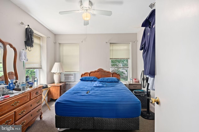 bedroom featuring ceiling fan, cooling unit, and carpet flooring