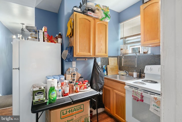 kitchen featuring light brown cabinetry, decorative backsplash, sink, and white appliances