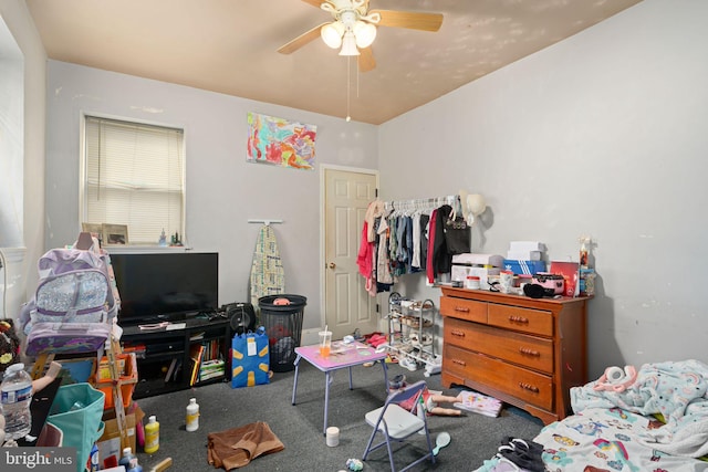 bedroom featuring ceiling fan and carpet