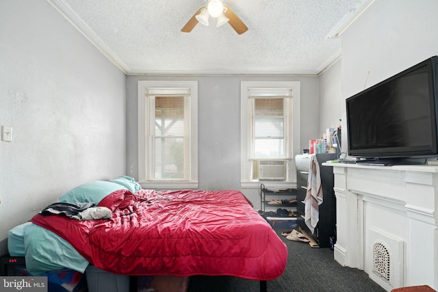 bedroom featuring ceiling fan, cooling unit, a textured ceiling, and ornamental molding