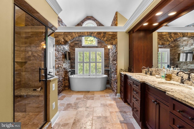 bathroom featuring plus walk in shower, vanity, and ornamental molding