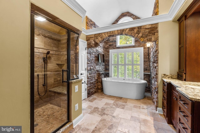 bathroom featuring vanity, separate shower and tub, and vaulted ceiling