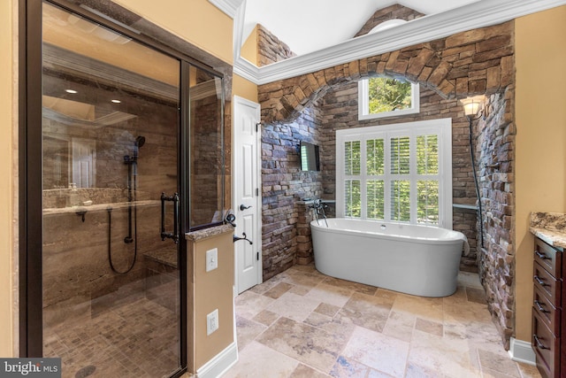 bathroom with crown molding, vanity, and independent shower and bath